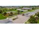 Community entrance with stone pillars, a gate, landscaping, and a basketball court at 2973 Blackwater Creek Dr, Lakeland, FL 33810