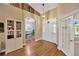 Inviting home foyer with hardwood floors and arched doorway leading to other rooms at 2973 Blackwater Creek Dr, Lakeland, FL 33810
