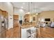 Open kitchen with stainless appliances, breakfast bar, and seamless flow to dining and living areas at 2973 Blackwater Creek Dr, Lakeland, FL 33810