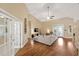 Open living room with high ceilings, hardwood floors, and French doors leading to the outside at 2973 Blackwater Creek Dr, Lakeland, FL 33810