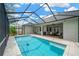 Back of home showing a covered pool and patio area and a fenced-in backyard at 2973 Blackwater Creek Dr, Lakeland, FL 33810