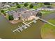 Aerial view of condo clubhouse with boat docks on the waterfront, offering recreational access at 4209 Club Cir, Lakeshore, FL 33854