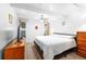 Bright bedroom featuring a ceiling fan, window with view, and a comfortable bed with decorative throw at 4209 Club Cir, Lakeshore, FL 33854