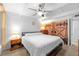 Comfortable bedroom features a neutral palette, ceiling fan, and ample natural light at 4209 Club Cir, Lakeshore, FL 33854