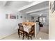 Cozy dining area featuring tile flooring and breakfast bar adjacent to the living area at 4209 Club Cir, Lakeshore, FL 33854