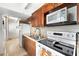 Bright kitchen featuring wood cabinets, stainless steel appliances, and tile flooring at 4209 Club Cir, Lakeshore, FL 33854