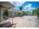 Inviting backyard patio with brick pavers, seating, and an outdoor dining area, perfect for entertaining at 739 Park Hill Ave, Lakeland, FL 33801