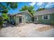Charming backyard patio featuring brick pavers, comfortable seating, and a lovely outdoor dining space at 739 Park Hill Ave, Lakeland, FL 33801