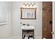 Bathroom with a stylish vanity and a walk-in shower featuring elegant tile work at 739 Park Hill Ave, Lakeland, FL 33801