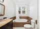 Bright bathroom featuring a soaking tub and modern fixtures at 739 Park Hill Ave, Lakeland, FL 33801