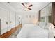 Bedroom showcasing hardwood floors, ceiling fan, and comfortable decor at 739 Park Hill Ave, Lakeland, FL 33801