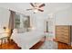 Comfortable bedroom showcasing hardwood floors, neutral decor, and a ceiling fan at 739 Park Hill Ave, Lakeland, FL 33801