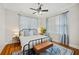 Bedroom featuring natural light, a ceiling fan, and an accent rug at 739 Park Hill Ave, Lakeland, FL 33801