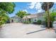 Charming home featuring a well-maintained yard, patio, and additional dwelling unit at 739 Park Hill Ave, Lakeland, FL 33801