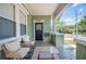 Inviting front porch with comfortable seating and charming details, perfect for relaxing outdoors at 739 Park Hill Ave, Lakeland, FL 33801