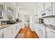 Well-lit kitchen with white cabinets, stainless appliances, and granite countertops at 739 Park Hill Ave, Lakeland, FL 33801