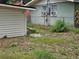 The property features a large grassy backyard and lots of potential at 3220 Avenue J Nw, Winter Haven, FL 33881