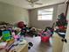 This bedroom features natural light and ample space, though it needs some cleaning at 3220 Avenue J Nw, Winter Haven, FL 33881
