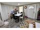 Bright dining area with a modern table set and decorative accents, adjacent to a white door at 3220 Avenue J Nw, Winter Haven, FL 33881