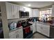 Modern kitchen equipped with stainless steel appliances, granite countertops, and white cabinetry at 3220 Avenue J Nw, Winter Haven, FL 33881