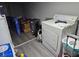 Laundry room features a washer and dryer hookup, new vinyl flooring, and storage space at 3220 Avenue J Nw, Winter Haven, FL 33881