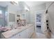 Well-lit bathroom features a double sink vanity with granite countertops, blending style and functionality at 2401 Lafayette Ave, Winter Park, FL 32789