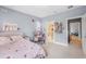 Charming bedroom with gray walls, carpet, and a desk area, offering a cozy and functional space at 2401 Lafayette Ave, Winter Park, FL 32789