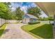 Detached garage with basketball hoop, paved driveway, and well manicured lawn perfect for outdoor fun at 2401 Lafayette Ave, Winter Park, FL 32789