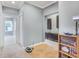 Bright hallway with tan carpet, built-in cabinets, and access to other rooms at 2401 Lafayette Ave, Winter Park, FL 32789