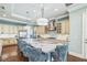 Spacious kitchen with custom cabinetry, stainless steel appliances, a large island, and hardwood floors at 2401 Lafayette Ave, Winter Park, FL 32789