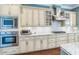 Well-equipped kitchen featuring stainless steel appliances and stylish cabinets at 2401 Lafayette Ave, Winter Park, FL 32789