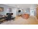 Large, flexible living room with space for relaxing and working, featuring neutral walls and soft carpeting at 2401 Lafayette Ave, Winter Park, FL 32789