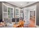 Home office space featuring custom window shutters and views of the outdoors at 2401 Lafayette Ave, Winter Park, FL 32789