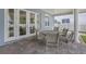 Covered patio with paver stones, providing ample seating and an open-air dining space at 2401 Lafayette Ave, Winter Park, FL 32789