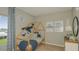 bedroom with playful whale-themed decor, a cozy bed, and plenty of natural light at 2442 Slippery Rock St, Auburndale, FL 33823