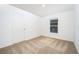 Bright bedroom featuring neutral carpet, white trim, and a window for natural light at 3228 Seville St, Lake Alfred, FL 33850