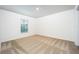 Comfortable bedroom with a neutral carpet and natural lighting from a window at 3228 Seville St, Lake Alfred, FL 33850