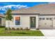 Charming single-story home with a well-manicured lawn and attached one car garage at 3228 Seville St, Lake Alfred, FL 33850