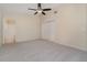 Neutral carpet bedroom with ceiling fan and access to an ensuite bathroom and closet at 3243 Winchester Estates Cir, Lakeland, FL 33810