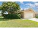 Charming single-story home with a two-car garage and manicured lawn at 3243 Winchester Estates Cir, Lakeland, FL 33810