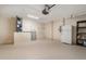 Spacious garage with standard door, utility equipment, and ample room for storage at 3243 Winchester Estates Cir, Lakeland, FL 33810