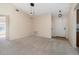 Inviting living room featuring plush carpeting, neutral paint, vaulted ceilings, and modern lighting fixtures at 3243 Winchester Estates Cir, Lakeland, FL 33810