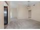Inviting living room featuring plush carpeting, neutral paint, vaulted ceilings, and modern lighting fixtures at 3243 Winchester Estates Cir, Lakeland, FL 33810