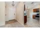 Inviting living room featuring plush carpeting, neutral paint, vaulted ceilings, and access to kitchen area at 3243 Winchester Estates Cir, Lakeland, FL 33810