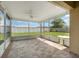 Covered screened-in patio offering views of the backyard with privacy fence at 3243 Winchester Estates Cir, Lakeland, FL 33810