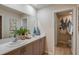 Bright bathroom featuring a double sink vanity, light gray cabinets, and decorative accents, creating a serene atmosphere at 3747 King Hill Dr, Haines City, FL 33844