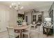 Open-concept living room featuring a dining area, decorative lighting, and comfortable seating arrangements at 3747 King Hill Dr, Haines City, FL 33844