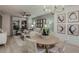 Elegant living room with modern furnishings, a ceiling fan, and an adjacent dining area at 3747 King Hill Dr, Haines City, FL 33844