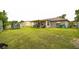 Backyard featuring a covered patio, trampoline, and lawn at 107 Talavera Ln, Kissimmee, FL 34758