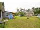 Spacious backyard featuring a play set, trampoline, and well-maintained lawn at 107 Talavera Ln, Kissimmee, FL 34758